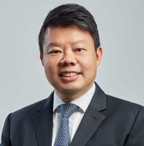 Asian Chief Technology Officer in a dark grey suit